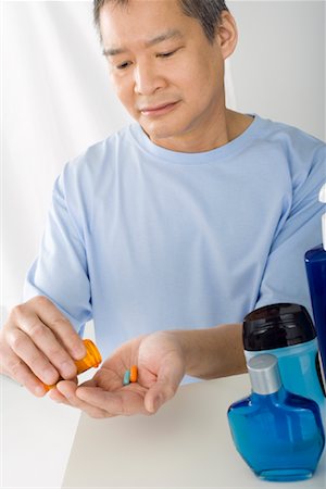 portrait chinese old man - Man with Pills in Bathroom Stock Photo - Rights-Managed, Code: 700-01276254