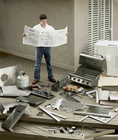 disorder in house - Man Assembling Barbecue Stock Photo - Rights-Managed, Code: 700-01295720