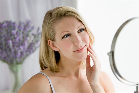 Woman Looking in Mirror Stock Photo - Rights-Managed, Code: 700-01296018