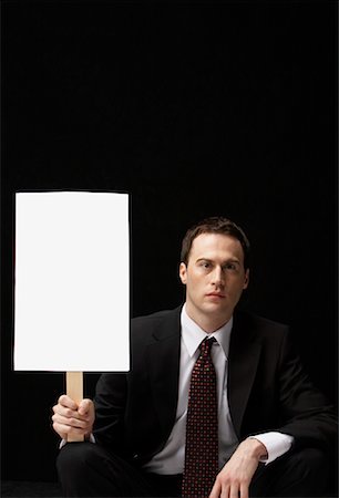 Businessman Holding Blank Sign Stock Photo - Rights-Managed, Code: 700-01296550