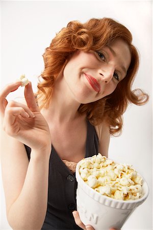 popcorn white background - Woman Eating Popcorn Stock Photo - Rights-Managed, Code: 700-01296648