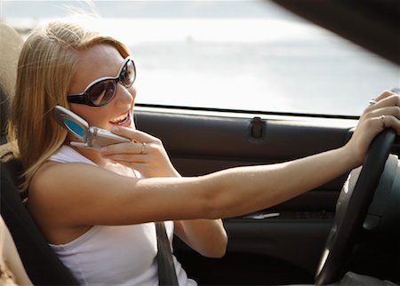 driver phone - Girl Using Cellular Phone While Driving Stock Photo - Rights-Managed, Code: 700-01344615