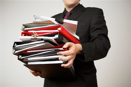 pile hands bussiness - Businessman Carrying Binders Stock Photo - Rights-Managed, Code: 700-01344641