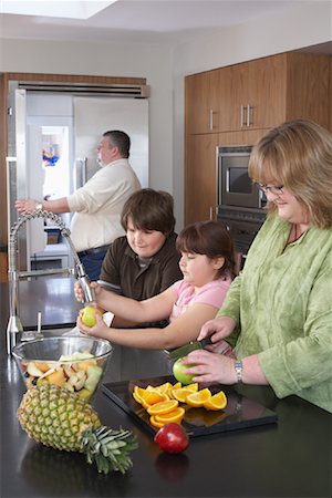 Family Making Fruit Salad Stock Photo - Rights-Managed, Code: 700-01345018