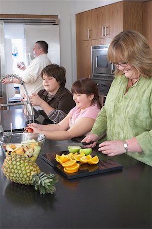 fat blond man - Family Making Fruit Salad Stock Photo - Rights-Managed, Code: 700-01345019