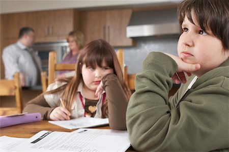 Children doing Homework at Kitchen Table Stock Photo - Rights-Managed, Code: 700-01345028
