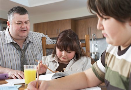 Father Watching Children do Homework Stock Photo - Rights-Managed, Code: 700-01345039