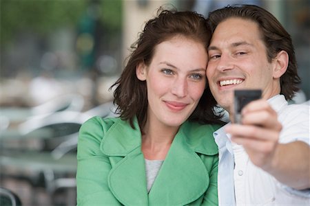 Couple Taking Self Portrait with Camera Phone Stock Photo - Rights-Managed, Code: 700-01374420