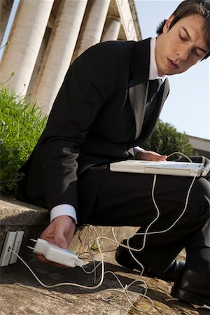 remote working - Businessman with Laptop Computer by Pillars Foto de stock - Con derechos protegidos, Código: 700-01378439