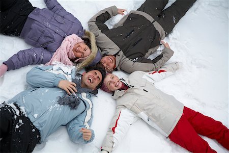 Portrait of Friends Lying in the Snow Stock Photo - Rights-Managed, Code: 700-01407311