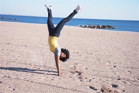 Woman doing handstand on beach Stock Photo - Rights-Managed, Code: 700-01429091