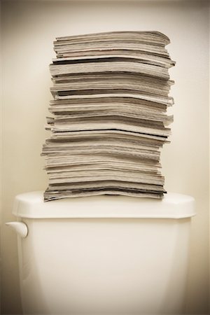 Magazines Stacked on Toilet Stock Photo - Rights-Managed, Code: 700-01429235