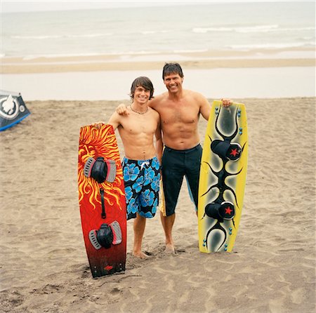 Father and Son with Wakeboards Foto de stock - Con derechos protegidos, Código: 700-01459113