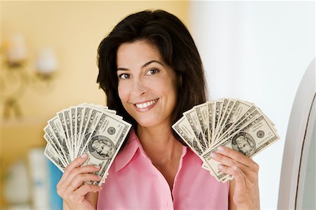 simsearch:700-02643197,k - Portrait of Woman Holding Money Stock Photo - Rights-Managed, Code: 700-01464006