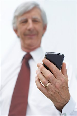 Businessman Reading Text Message Stock Photo - Rights-Managed, Code: 700-01464159