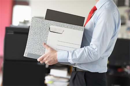 reducción de personal - Businessman Carrying Box Foto de stock - Con derechos protegidos, Código: 700-01464246