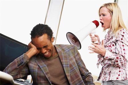 surprised adult work casual - Woman Using Megaphone to Talk to Man Stock Photo - Rights-Managed, Code: 700-01464528