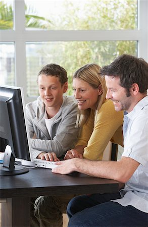 father bending over - Family Using Computer Stock Photo - Rights-Managed, Code: 700-01463768