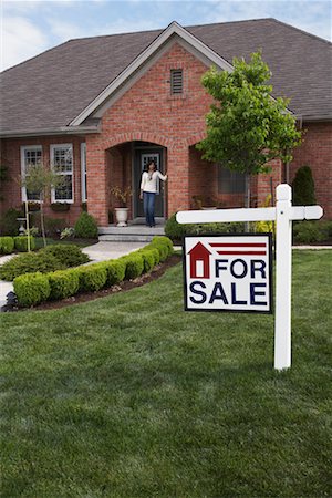 Portrait of Woman by House with Sold Sign Stock Photo - Rights-Managed, Code: 700-01494567