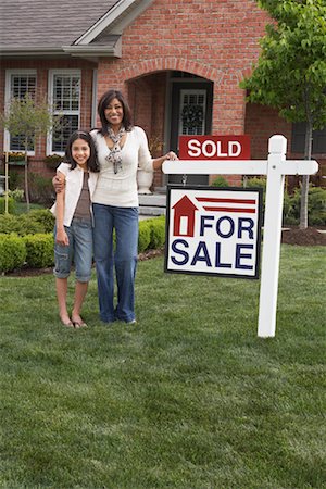pictures of families with the sold sign on new house - Portrait of Mother and Daughter By Sold Sign Stock Photo - Rights-Managed, Code: 700-01494561