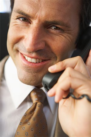 suit business man close up face one person only - Homme d'affaires parlait au téléphone Photographie de stock - Rights-Managed, Code: 700-01494706