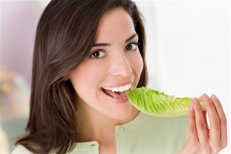 eat mouth closeup - Woman Eating Lettuce Stock Photo - Rights-Managed, Code: 700-01574760