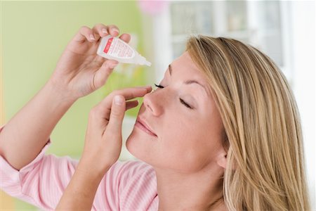 Woman Using Eye Drops Stock Photo - Rights-Managed, Code: 700-01574778