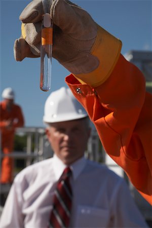 Worker Holding Test Tube Stock Photo - Rights-Managed, Code: 700-01575512