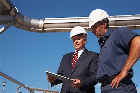 Workers Looking at Clipboard Stock Photo - Rights-Managed, Code: 700-01575523