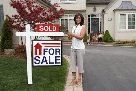 sold - Real Estate Agent by House with Sold Sign Stock Photo - Rights-Managed, Code: 700-01571964