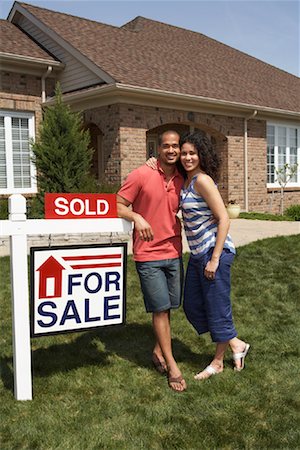 real estate people eye contact - Couple by Sold Sign Stock Photo - Rights-Managed, Code: 700-01571988