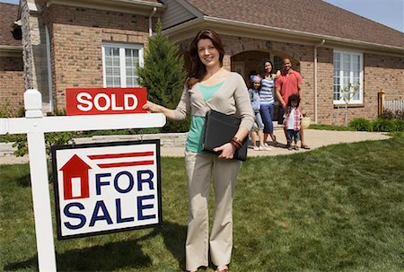 family with sold sign - Real Estate Agent by Sold Sign Stock Photo - Rights-Managed, Code: 700-01571980