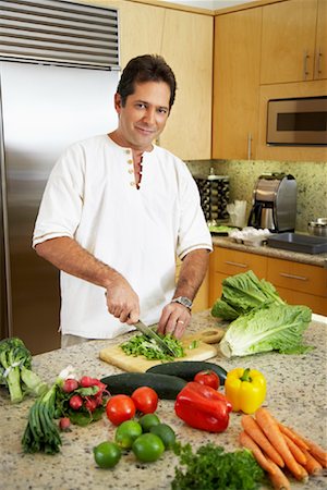 diced bell pepper - Man in Kitchen Preparing Dinner Stock Photo - Rights-Managed, Code: 700-01572076