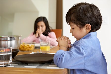 saying grace at male dinner - Brother and Sister Praying Before Meal Stock Photo - Rights-Managed, Code: 700-01585863