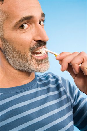 L'homme le brossage des dents Photographie de stock - Rights-Managed, Code: 700-01586207