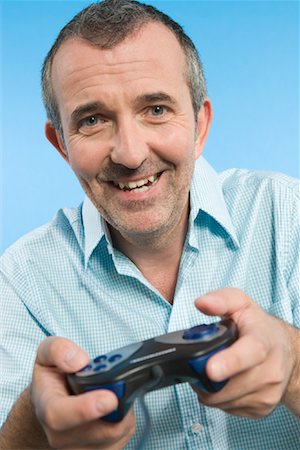 Man Playing Video Games Stock Photo - Rights-Managed, Code: 700-01587296