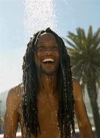 dreadlocks on african americans - Man Showering at Beach Stock Photo - Rights-Managed, Code: 700-01587327