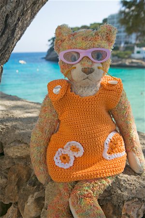 Toy Cat Sitting on Sea Wall, Majorca, Spain Stock Photo - Rights-Managed, Code: 700-01587349