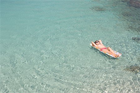 Woman Floating in Ocean, Majorca, Spain Foto de stock - Con derechos protegidos, Código: 700-01587383