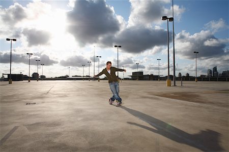 Man Dancing in Parking Lot Stock Photo - Rights-Managed, Code: 700-01587399