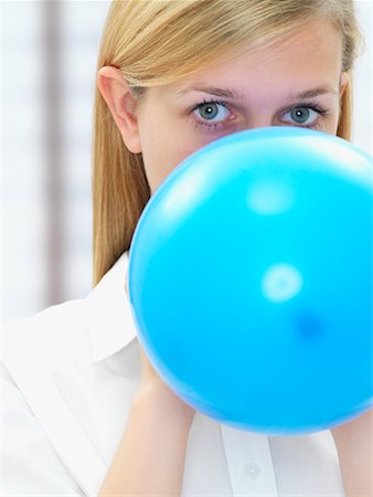 Femme Blowing Up Balloon Photographie de stock - Rights-Managed, Code: 700-01587489