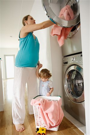 pregnant housework - Mother Doing Laundry Stock Photo - Rights-Managed, Code: 700-01581879