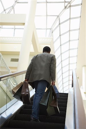 shopaholic (male) - Man on Escalator at the Mall Stock Photo - Rights-Managed, Code: 700-01594068