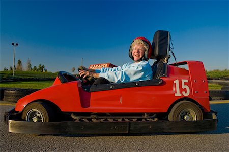 simsearch:700-03445625,k - Woman Driving Go-Cart Fotografie stock - Rights-Managed, Codice: 700-01595739