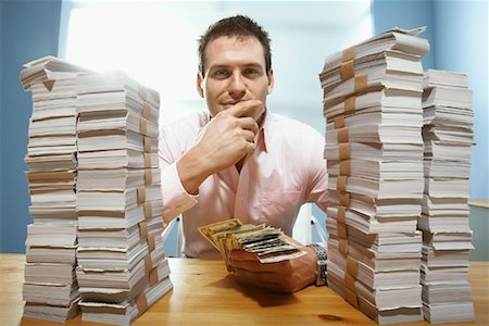 Man at Desk, Counting Money Stock Photo - Rights-Managed, Code: 700-01606385