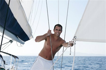 Man on Boat, Dodecanese, Greece Stock Photo - Rights-Managed, Code: 700-01607128