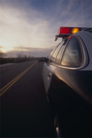 Police Car Driving Foto de stock - Con derechos protegidos, Código: 700-01616812