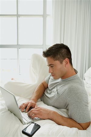 Man Using Laptop Stock Photo - Rights-Managed, Code: 700-01630393