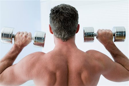 person lifting shoulder - Man Lifting Weights Stock Photo - Rights-Managed, Code: 700-01646201