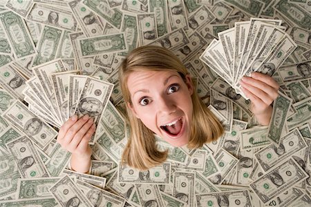 excited women holding money - Woman Surrounded by Money Stock Photo - Rights-Managed, Code: 700-01646203